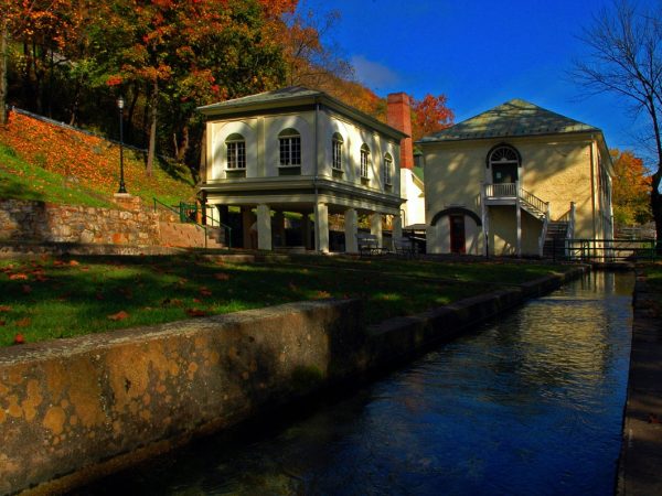 historic park buildings and channel of spring water