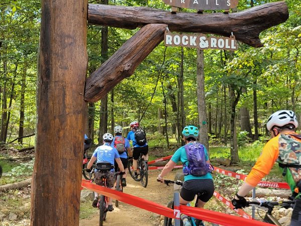 several people with bikes riding on trail